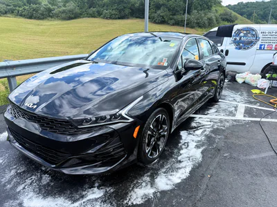 Black Kia with professional exterior detailing and brilliant shine