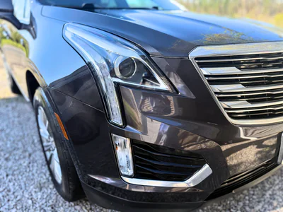 SUV headlight area showing precision paint protection installation