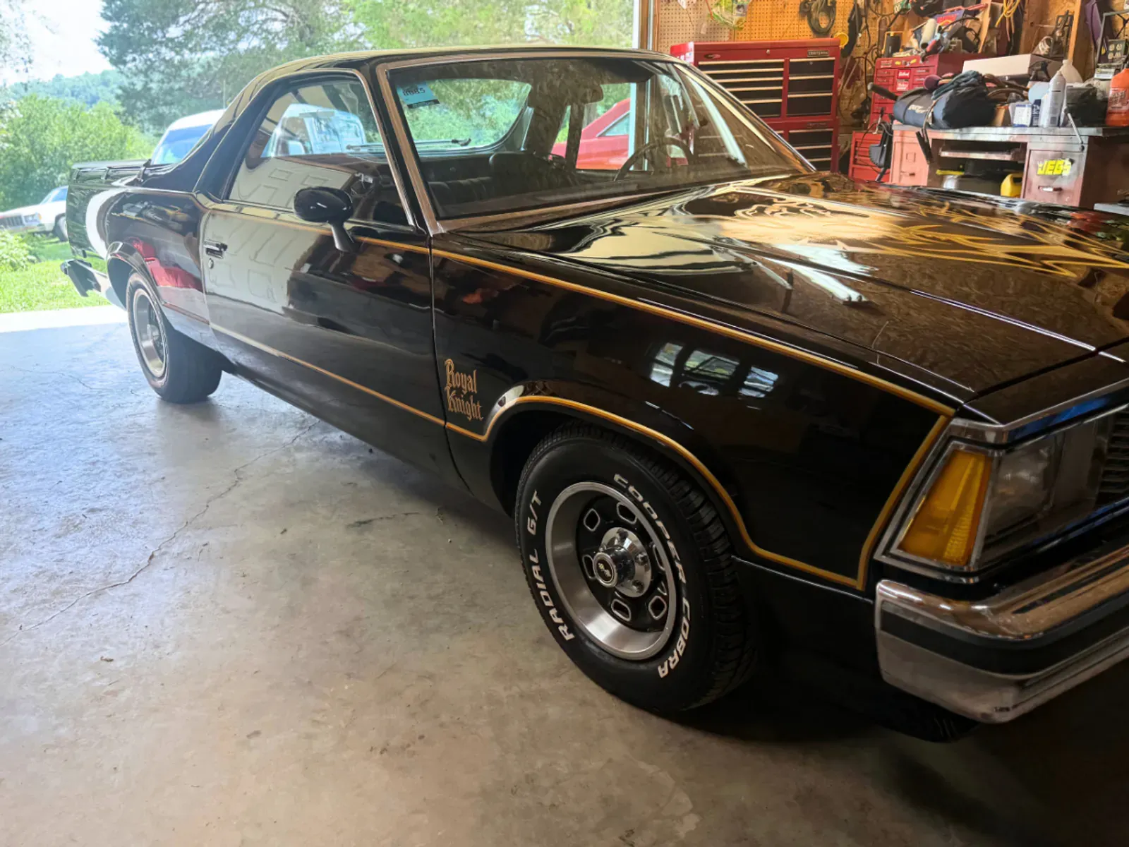 El Camino passenger front angle showing flawless paint correction results