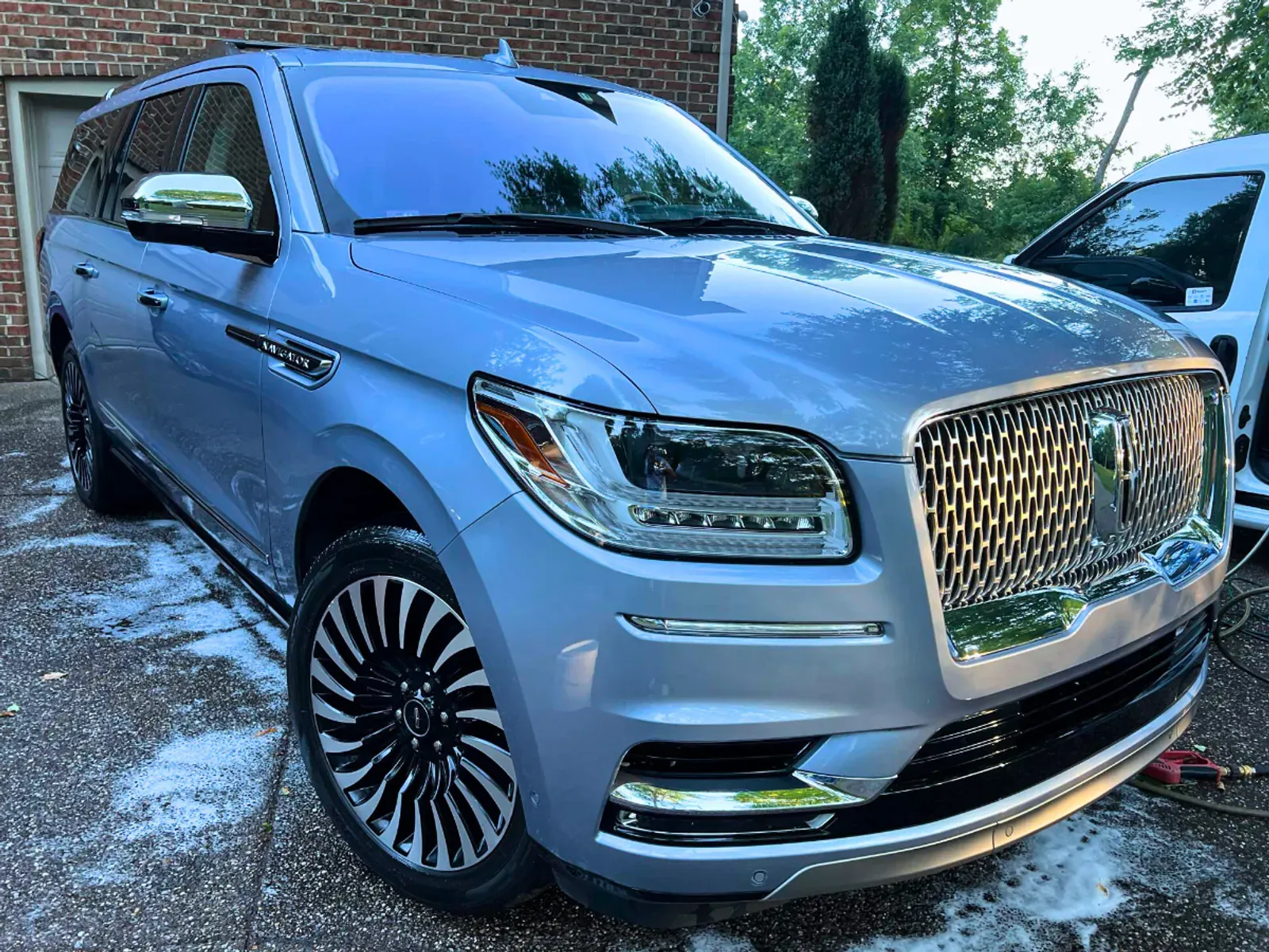 Light blue Lincoln showing flawless paint finish and professional detailing results