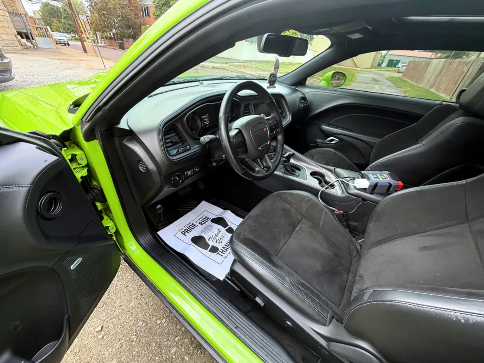 Lime green Dodge Challenger steering wheel and interior detailing