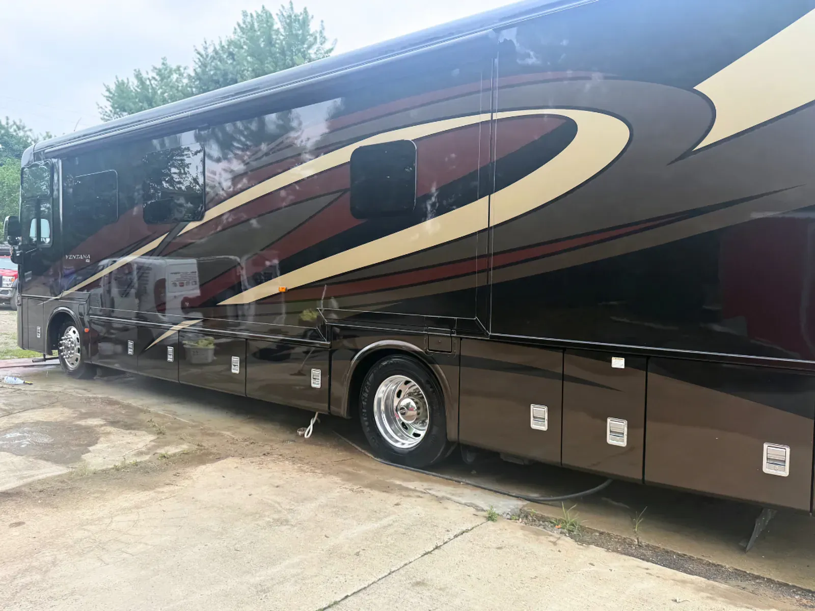 RV rear driver side angle showing complete exterior detailing