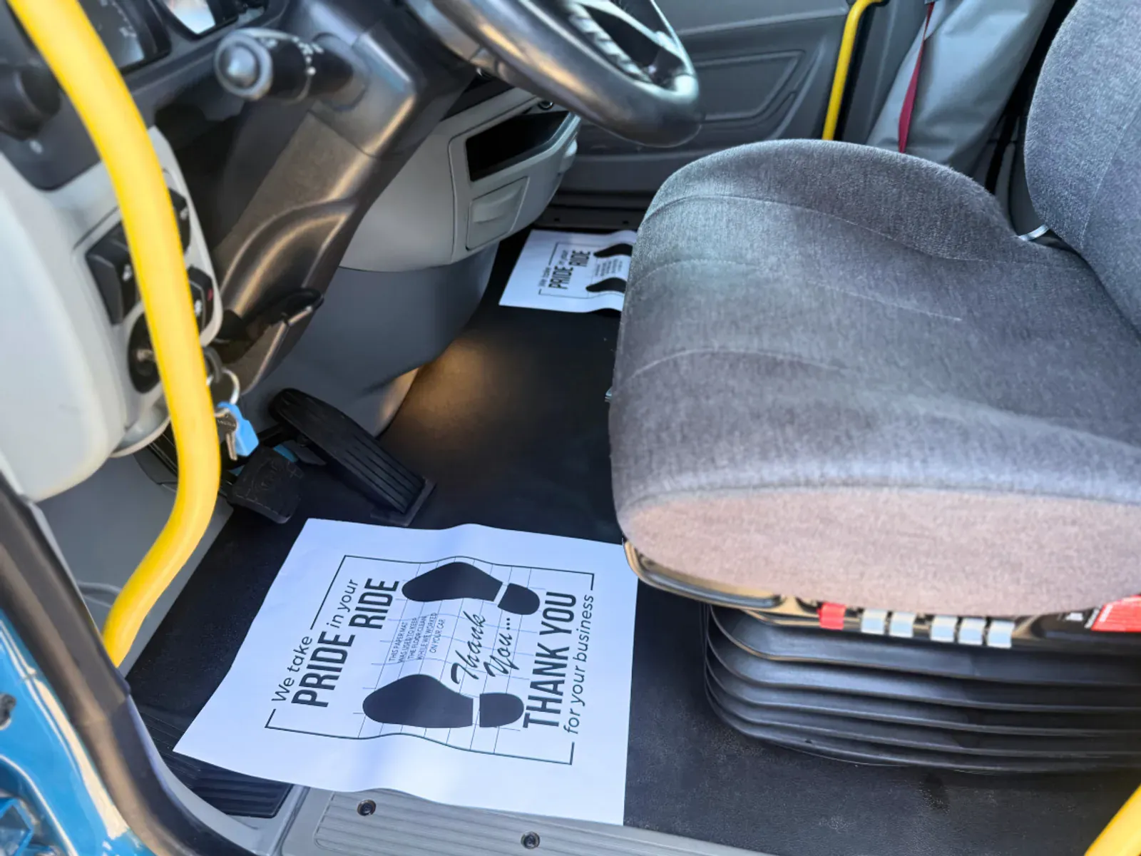 Semi-truck driver side floor area showing thorough cleaning