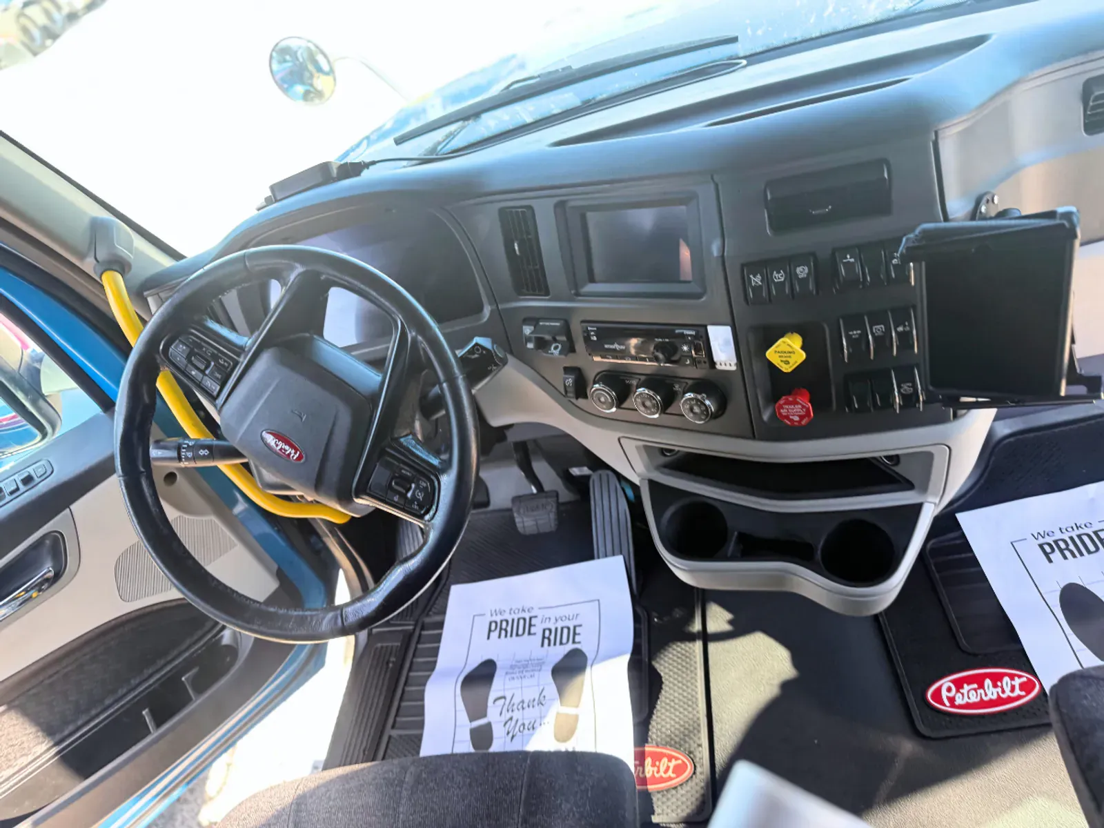 Cleaned semi-truck cab interior with detailed steering wheel and dash